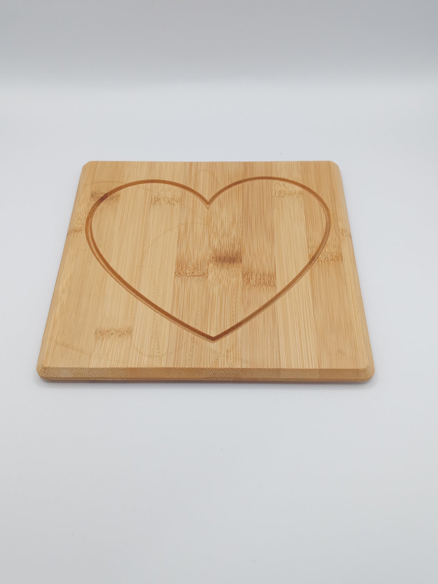 Heart engraved bamboo cutting board