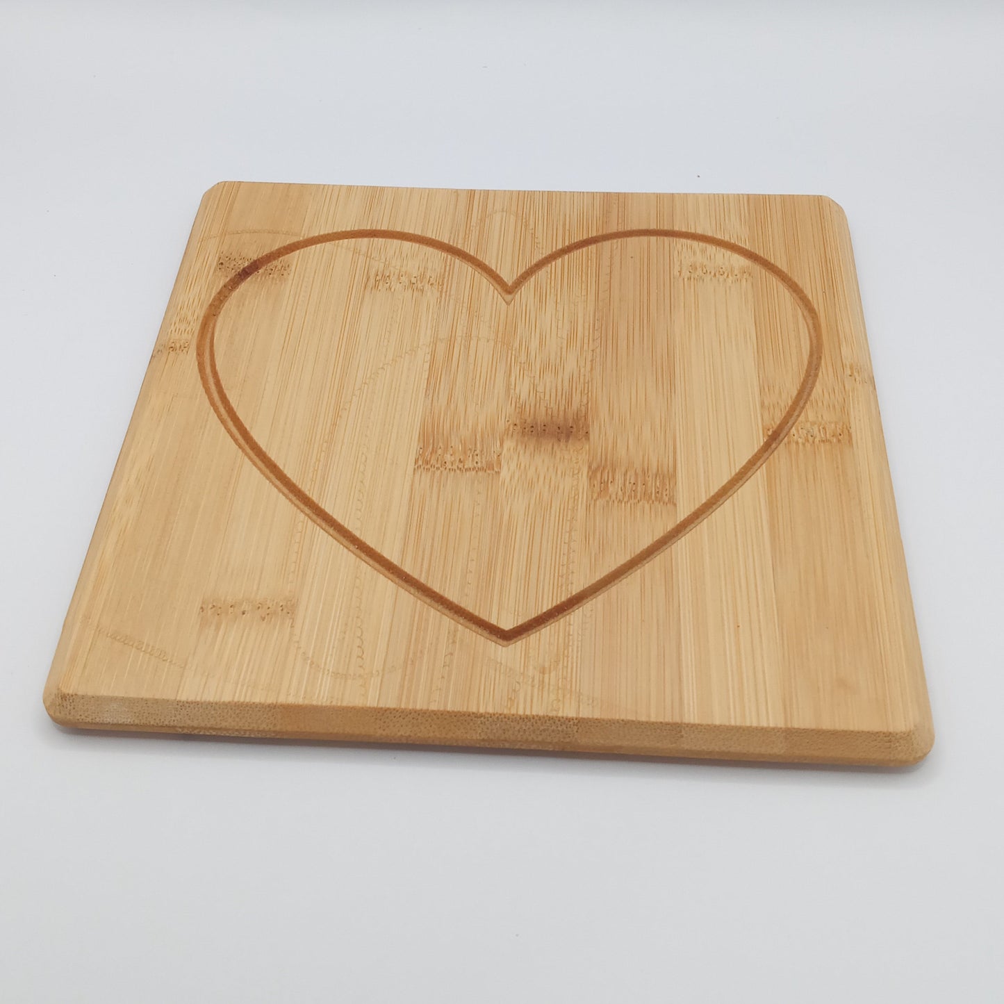 Heart engraved bamboo cutting board